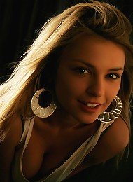 Charming blonde with adorable face and youthful allure.