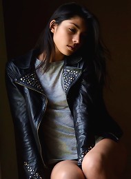 Antoinette exudes a lusty swagger wearing a black leather jacket and an intense gaze in her eyes.